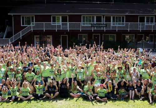 Group photo of the Campers in green shirts and Volunteers in blue shirts all part of Camp Wieser 2017 - no cost family retreat for adults with cancer
